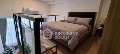 Modern loft bedroom with stylish decor and cozy ambiance
