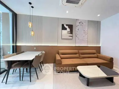 Modern living room with stylish furniture and elegant lighting in a contemporary apartment.