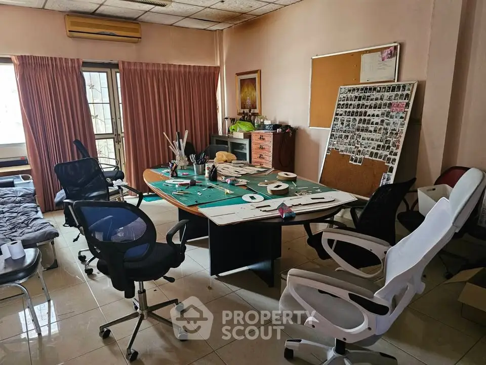 Spacious home office with ample natural light and modern furnishings, ideal for productivity and creativity.