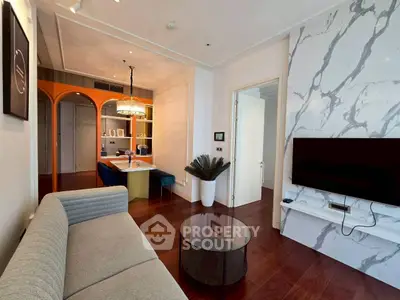 Modern living room with stylish decor and marble accent wall