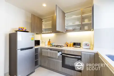 Modern kitchen with sleek cabinetry and built-in appliances