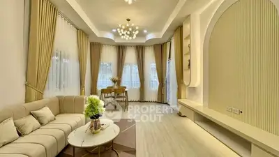 Elegant living room with modern decor and ample natural light