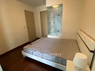 Cozy bedroom with modern decor and comfortable bed in a stylish apartment.