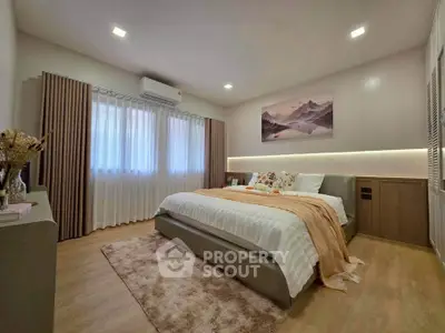 Elegant bedroom with cozy decor and soft lighting, featuring a plush bed and stylish curtains.