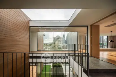 Modern multi-level home with open layout and city view, featuring sleek design and abundant natural light.