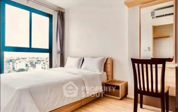 Modern bedroom with city view and minimalist decor