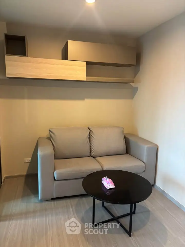 Modern living room with sleek sofa and stylish shelving, perfect for urban living.