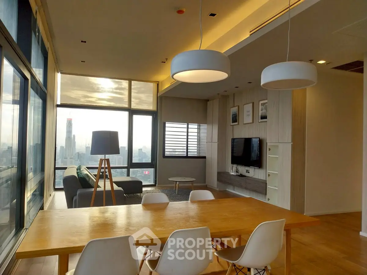 Modern living room with city view, stylish lighting, and elegant dining area.