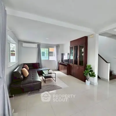 Spacious modern living room with sleek furniture and natural light
