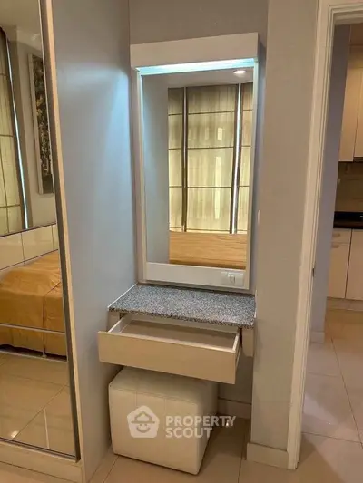 Elegant bedroom vanity with mirror and drawer, perfect for modern interiors.