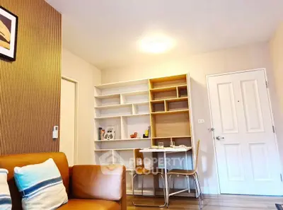 Cozy living room with modern furniture and built-in shelving, perfect for urban living.
