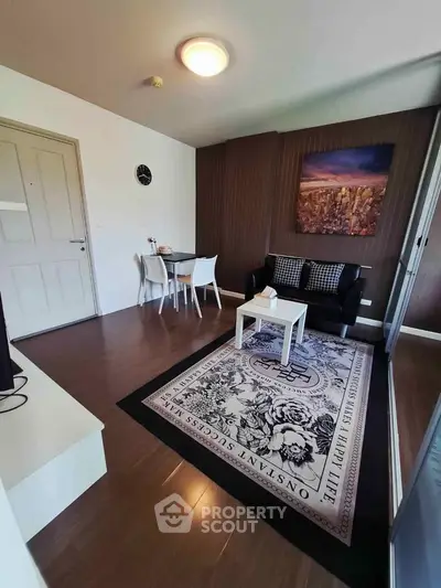Chic living room with modern decor, cozy seating, and stylish dining area, perfect for urban living.