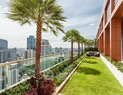 Luxurious rooftop garden with stunning city skyline views and lush greenery.