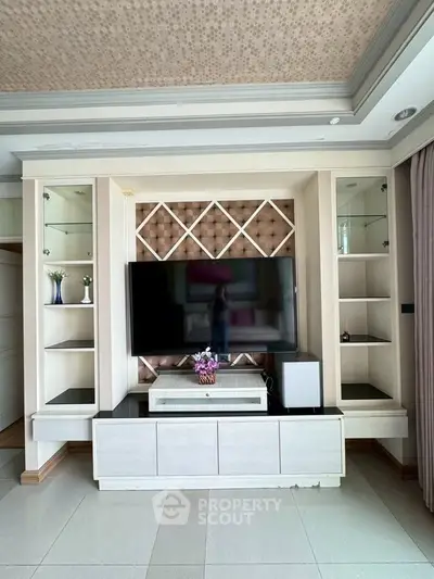 Elegant living room with modern entertainment center and stylish decor
