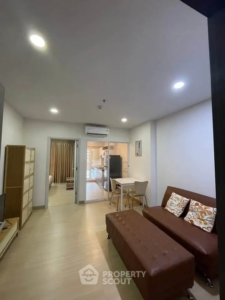 Modern living room with open layout and stylish furniture in a cozy apartment.