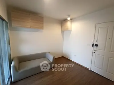 Cozy living room with modern sofa and wooden flooring