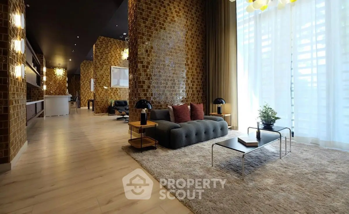 Luxurious modern living room with stylish decor and large windows