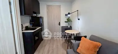 Cozy modern studio with sleek kitchen and stylish living area, perfect for urban living.