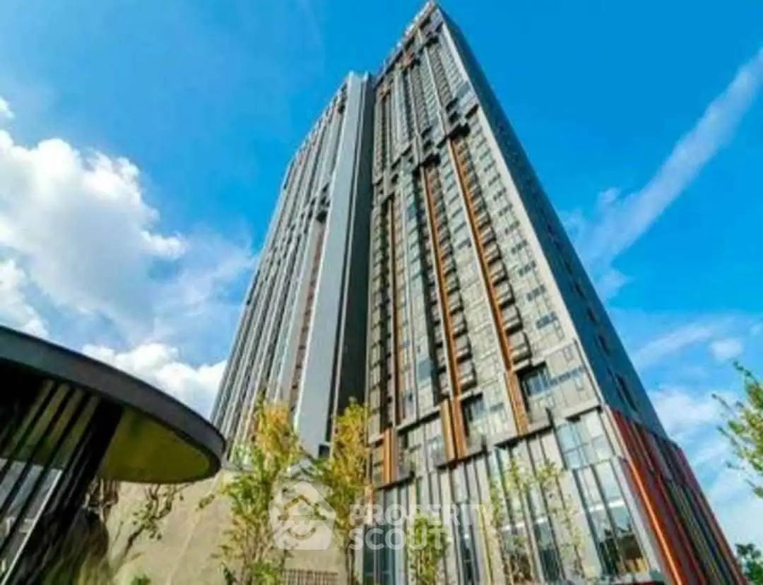 Stunning high-rise building with modern architecture against a clear blue sky.