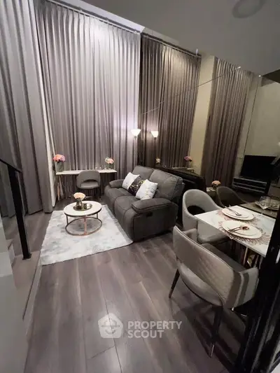 Stylish modern living room with elegant dining area and cozy seating, perfect for urban living.
