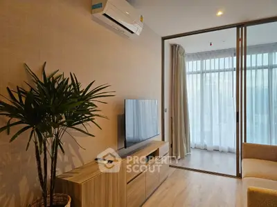 Modern living room with air conditioning and balcony view in stylish apartment.