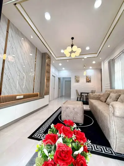 Luxurious living room with elegant decor and modern lighting in a stylish home.
