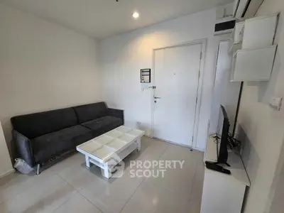 Modern living room with sleek furniture and minimalist design, perfect for urban living.