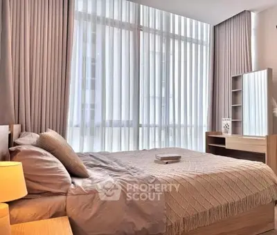 Luxurious bedroom with floor-to-ceiling windows and elegant decor