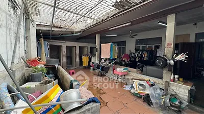 Spacious outdoor area with laundry facilities and storage space in a residential property.