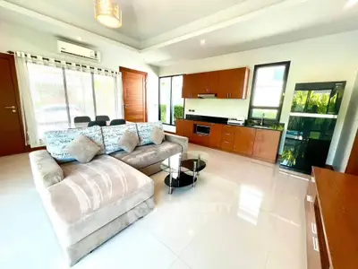 Spacious modern living room with open kitchen and stylish furniture
