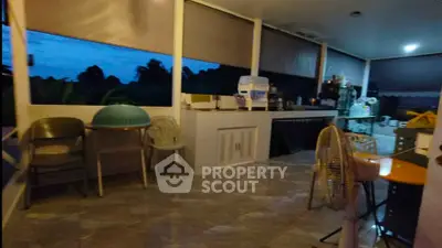 Spacious outdoor terrace with seating and scenic view, perfect for relaxation and gatherings.
