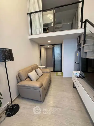 Modern loft apartment with stylish living room and mezzanine level
