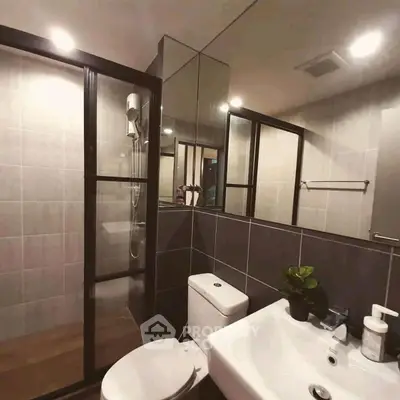 Modern bathroom with sleek design and glass shower enclosure