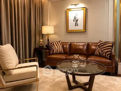 Luxurious living room with leather sofa, elegant armchair, and stylish decor in a modern apartment.