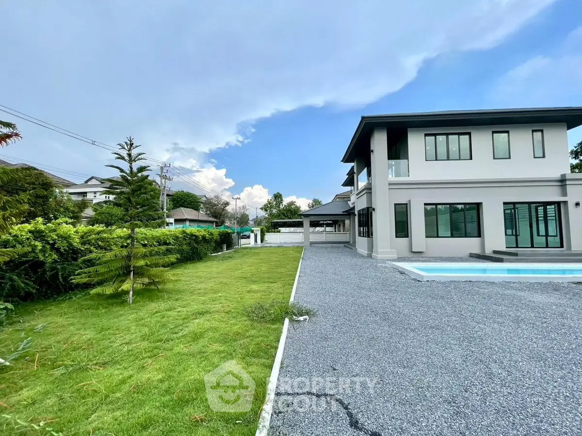 Stunning modern home with spacious garden and pool, perfect for luxury living.