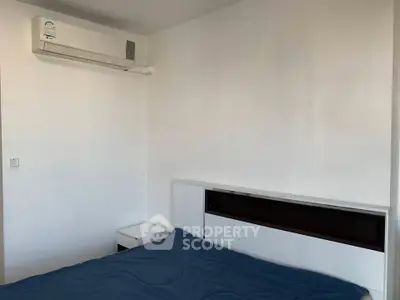 Minimalist bedroom with air conditioning and modern bed design