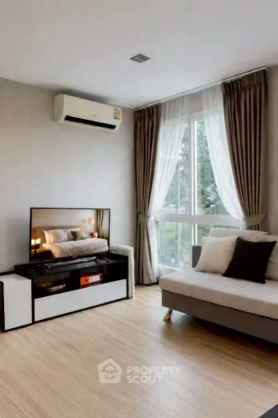 Modern living room with air conditioning and stylish decor, featuring a large window with elegant curtains.