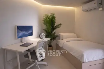 Modern minimalist bedroom with workspace and air conditioning