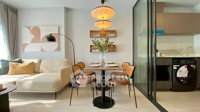 Modern living room with stylish dining area and open kitchen layout