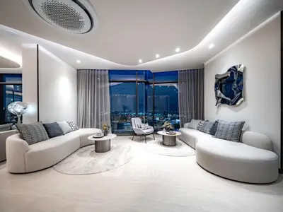 Luxurious modern living room with panoramic city views and stylish decor