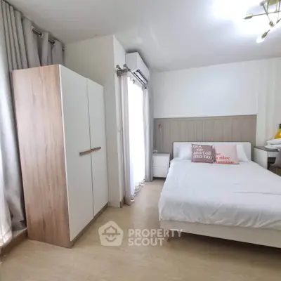 Modern bedroom with cozy decor and natural light