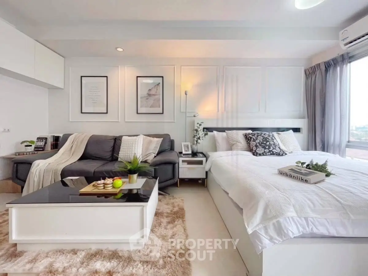 Modern studio apartment with cozy living area and stylish decor