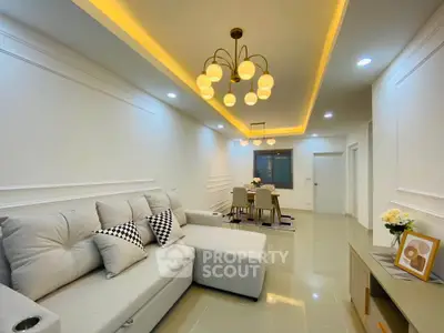 Modern living room with elegant lighting and cozy seating area