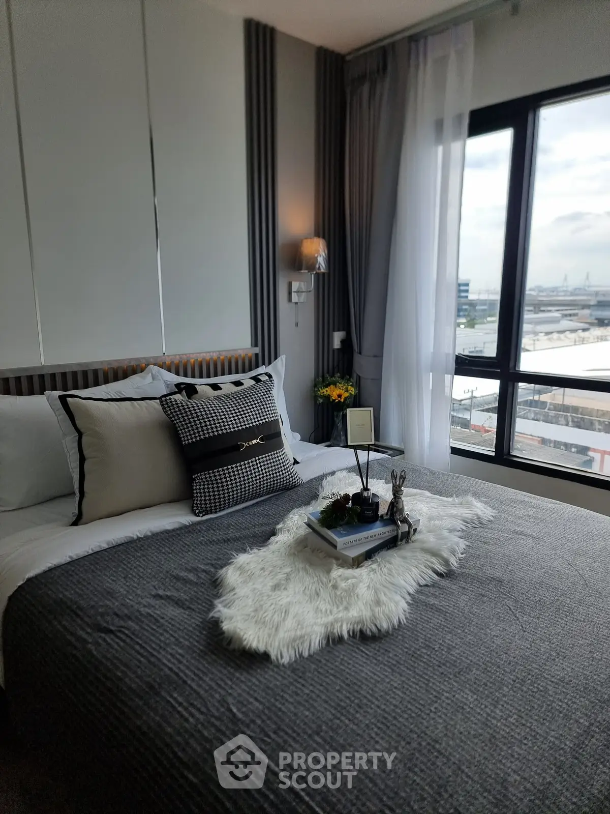 Luxurious bedroom with city view and elegant decor