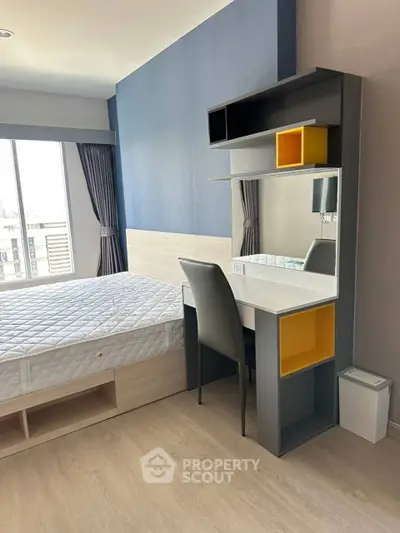 Modern bedroom with stylish desk and large window for natural light