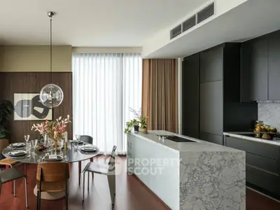 Luxurious modern kitchen with marble island and elegant dining area, featuring floor-to-ceiling windows.