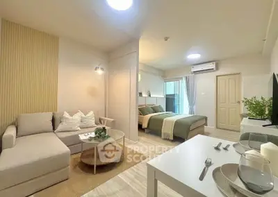 Modern studio apartment with cozy living area and stylish decor