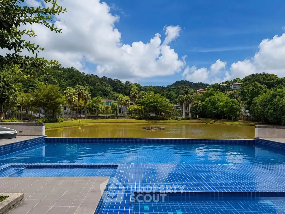 Luxurious infinity pool with stunning nature view in a serene residential area.