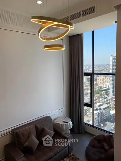 Modern living room with stylish lighting and city view from large window