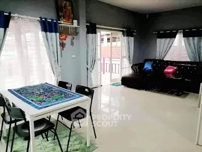 Spacious living room with modern decor and ample natural light